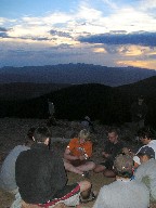 Playing cards at sunset on Mount Phillips